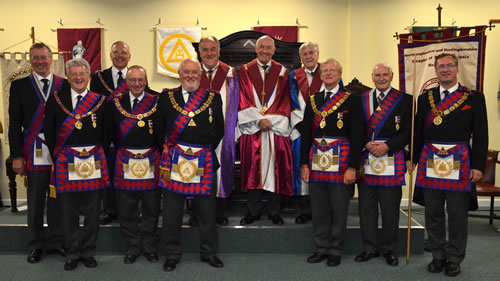 ME Second Grand Principal, George Pipon Francis (third from right), the MEGS, EComp Wayne Williams (fifth from left) with Chapter Principals and Provincial team & banner (right background)