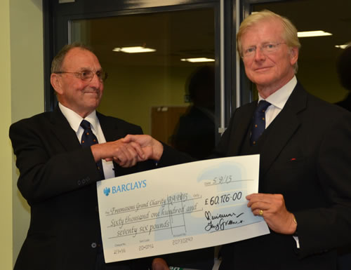 EComp Mike Green presents the cheque to the ME Second Grand Principal