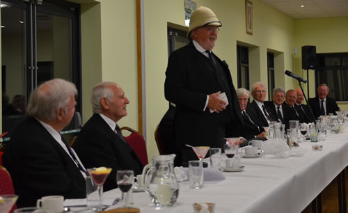 To the amusement of the Companions MEZ responds to his toast having donned his new pith helmet