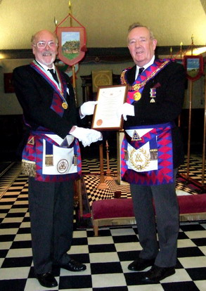 E Comp Alan Stewart presented with his certificate by Deputy Grand Superintendent, E Comp Ken Bacon