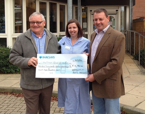 WBro Steve Storey (right) presents the £11,782 to Cynthia Spenser staff Sarah Pearson and John Helm